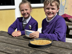 children cooking outside