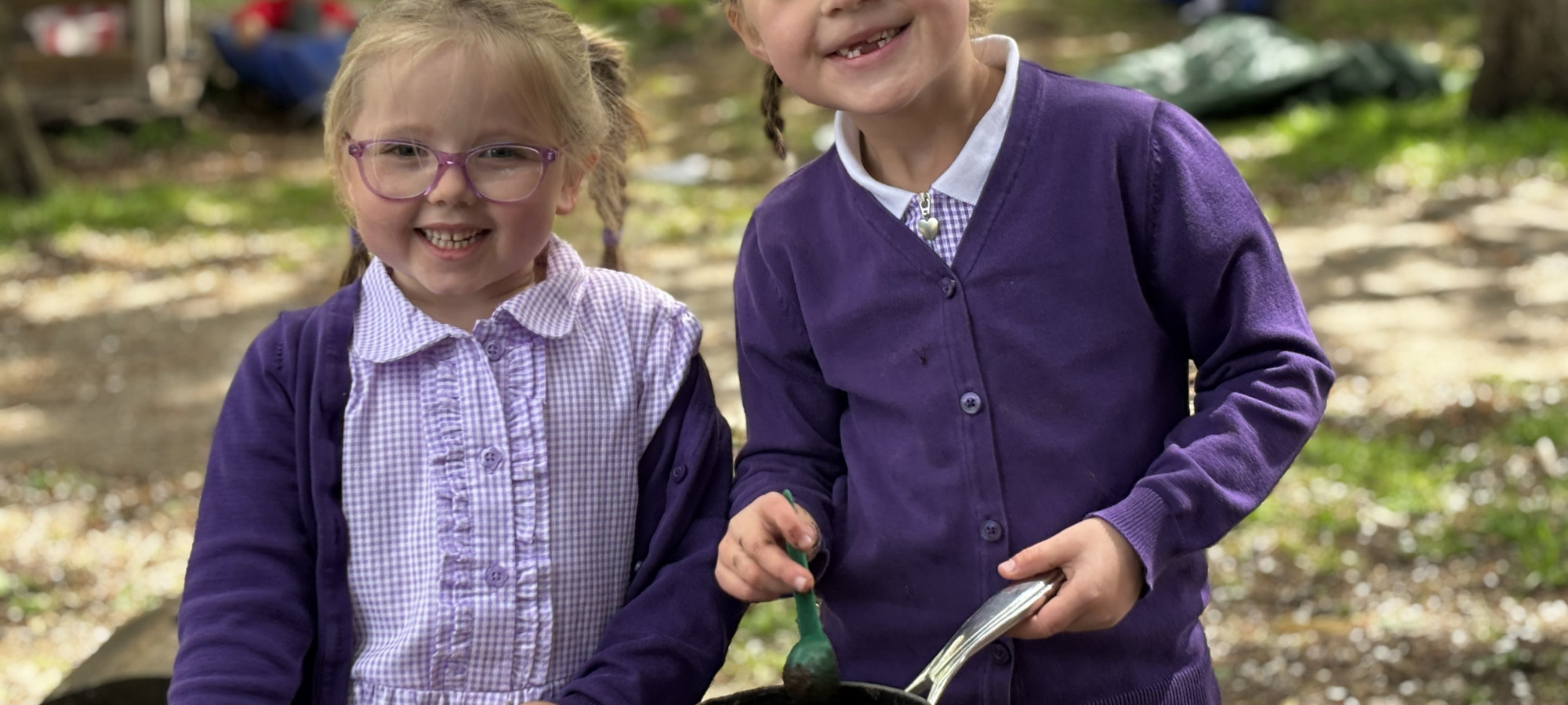 Children in mud kitchen 2